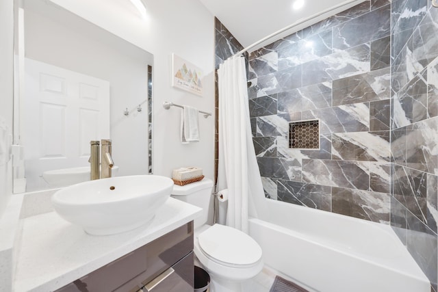 full bathroom featuring vanity, shower / bathtub combination with curtain, and toilet