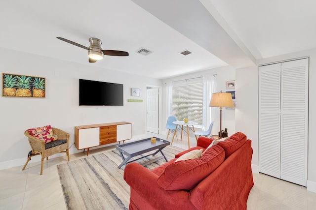 living room featuring ceiling fan and light tile patterned flooring