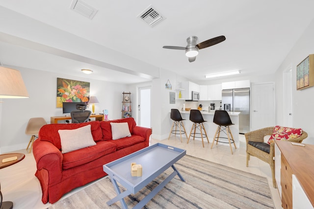 living room featuring ceiling fan