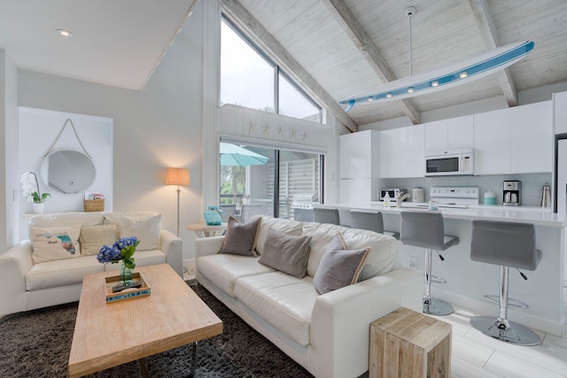 living room with beamed ceiling, wood ceiling, and high vaulted ceiling