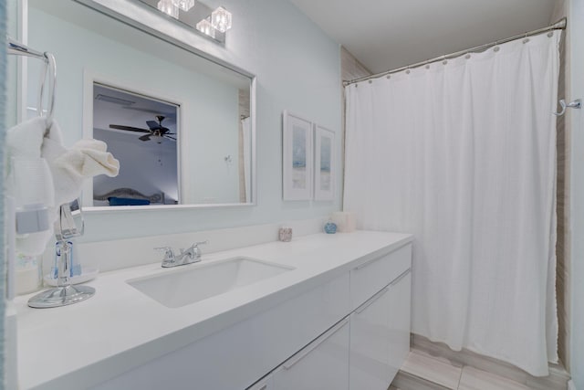 bathroom featuring ceiling fan and vanity