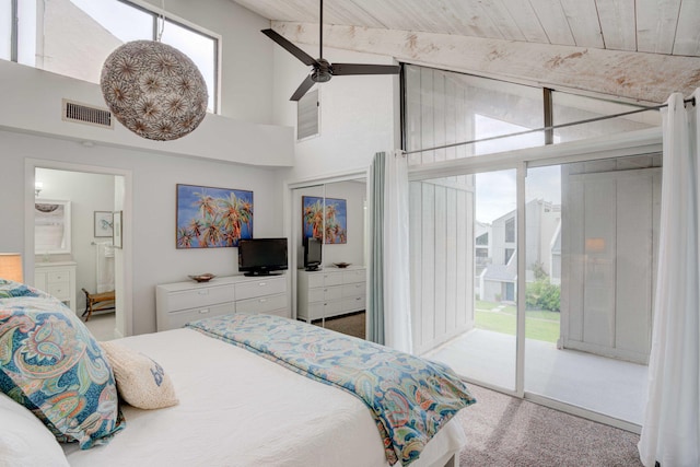 carpeted bedroom featuring access to exterior, ensuite bath, wood ceiling, ceiling fan, and lofted ceiling