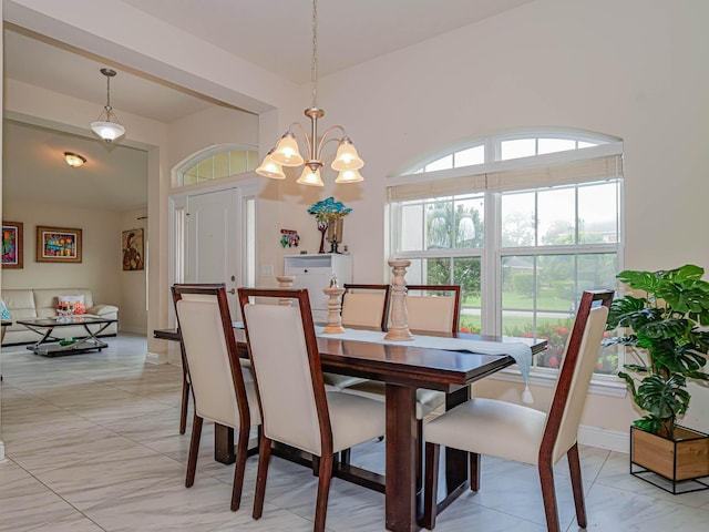 dining space with a notable chandelier