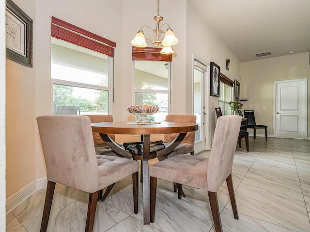 dining room featuring a chandelier