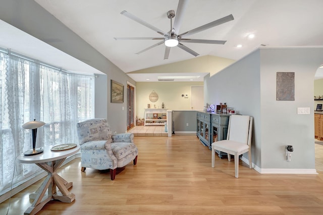 sitting room featuring ceiling fan, light hardwood / wood-style flooring, and lofted ceiling