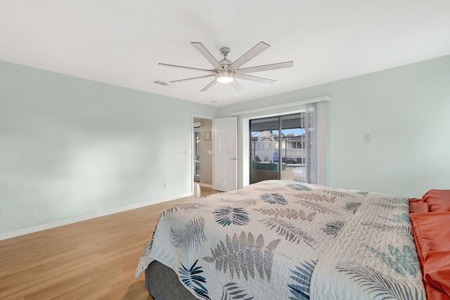 bedroom with access to outside, ceiling fan, and light wood-type flooring