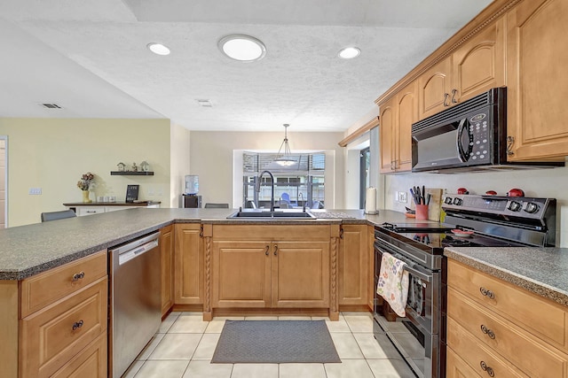 kitchen featuring sink, light tile patterned floors, a textured ceiling, kitchen peninsula, and stainless steel appliances