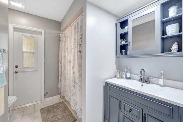 bathroom featuring a shower with curtain, tile patterned flooring, vanity, and toilet