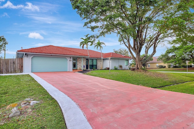 ranch-style home featuring a front yard and a garage