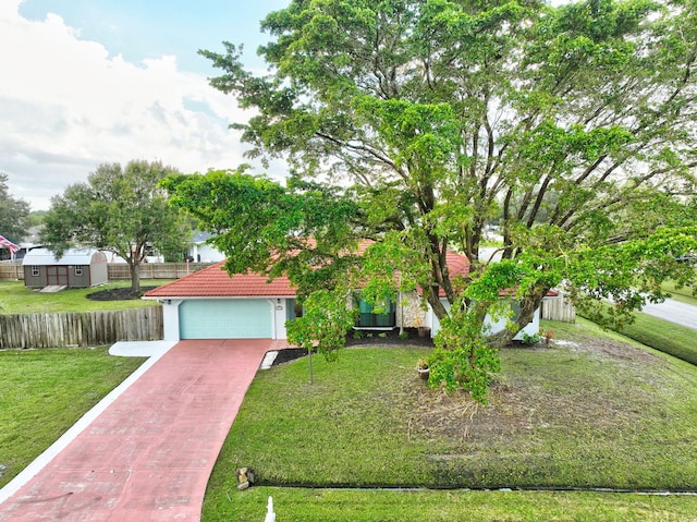 view of front of house featuring a front yard and a garage