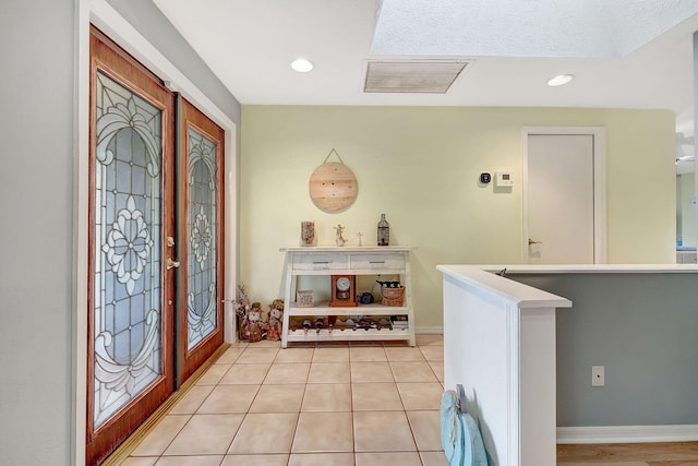 tiled foyer with french doors