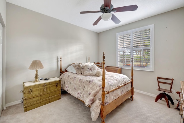 bedroom with light colored carpet and ceiling fan