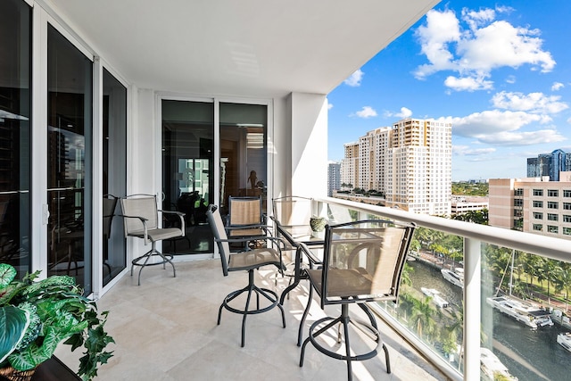 balcony featuring a water view