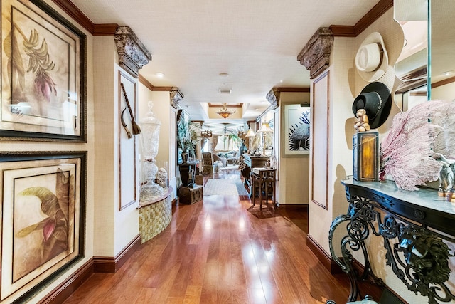 hall featuring dark hardwood / wood-style floors and ornamental molding