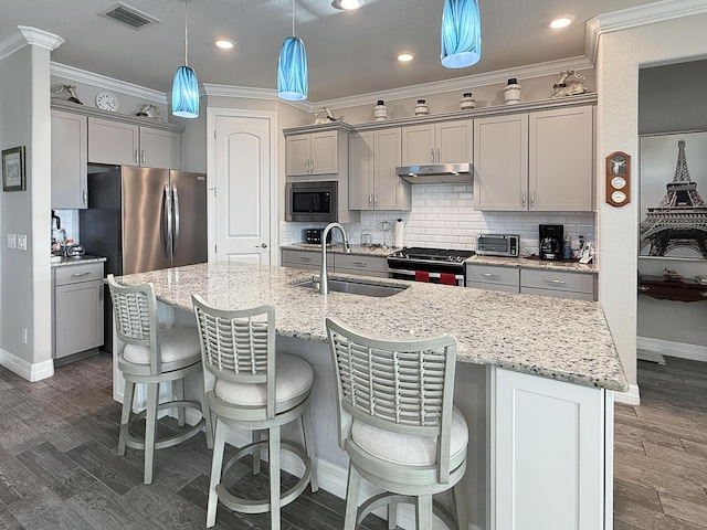 kitchen with sink, backsplash, gray cabinets, and appliances with stainless steel finishes