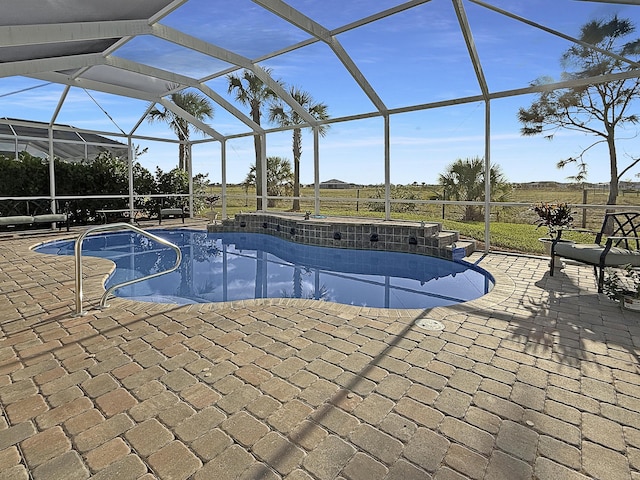 view of pool featuring a lanai and a patio area