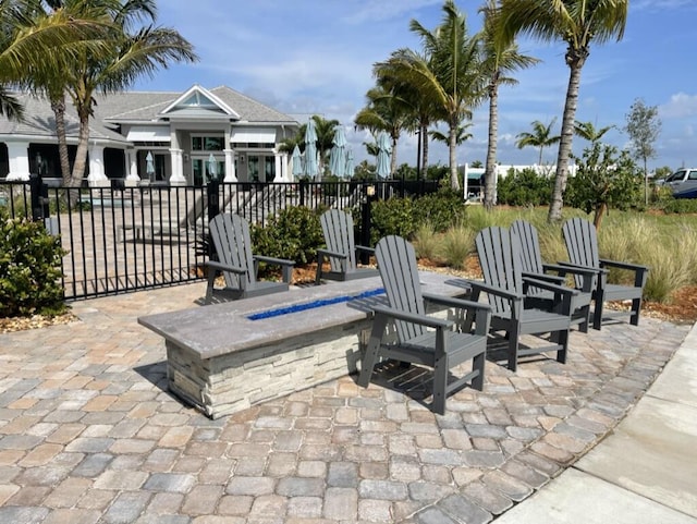 view of patio / terrace featuring an outdoor fire pit