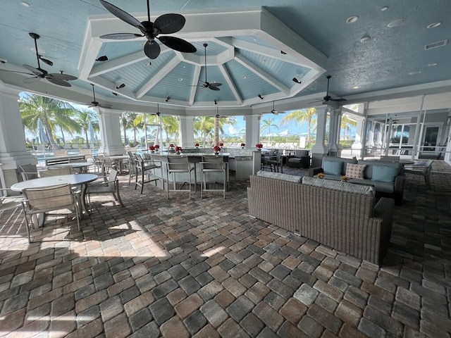 view of patio / terrace featuring outdoor lounge area, an outdoor bar, and ceiling fan