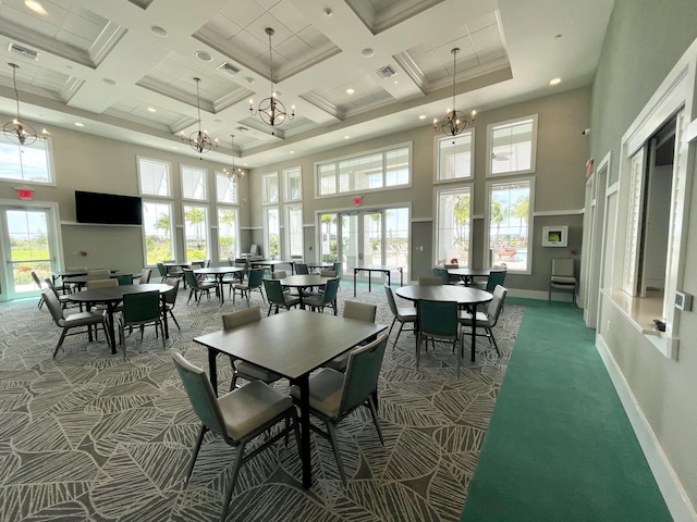 carpeted dining area featuring an inviting chandelier, coffered ceiling, beam ceiling, and a high ceiling