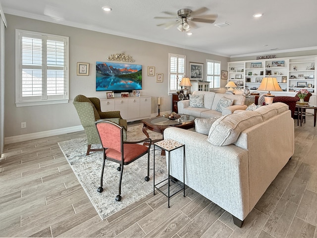 living room featuring ceiling fan and ornamental molding