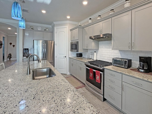 12880 SW Aureolian Ln, Port Saint Lucie, FL 34987 - kitchen featuring a sink, a toaster, appliances with stainless steel finishes, under cabinet range hood, and gray cabinetry