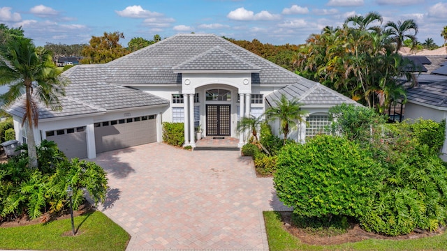 view of front facade with french doors and a garage