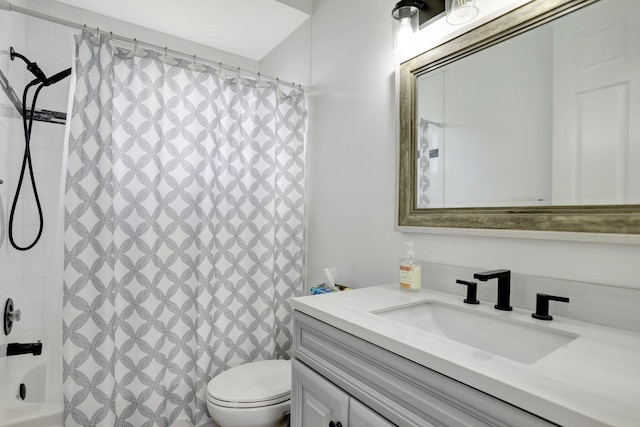 full bathroom featuring shower / bathtub combination with curtain, vanity, and toilet