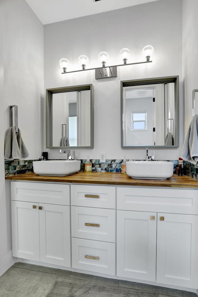 bathroom with tile patterned floors and vanity