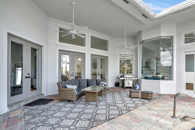 view of patio / terrace with an outdoor living space, ceiling fan, grilling area, and french doors