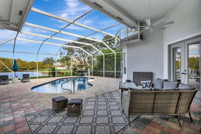 view of swimming pool with glass enclosure, an outdoor hangout area, a patio, and french doors