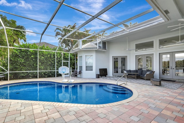 view of pool featuring a lanai, ceiling fan, french doors, and a patio