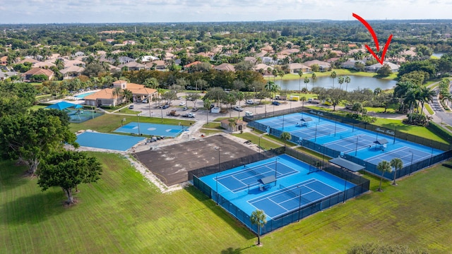 birds eye view of property with a water view