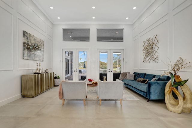 living room featuring crown molding and french doors