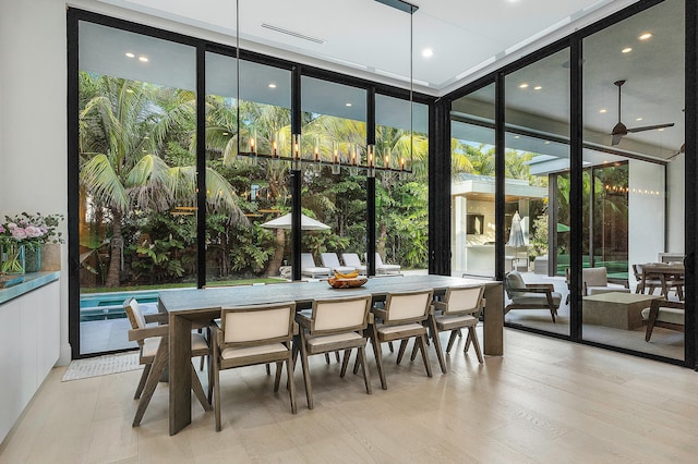 sunroom featuring ceiling fan