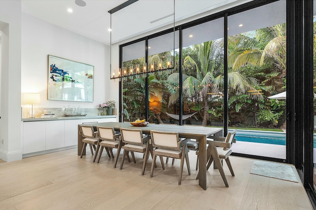 dining area featuring light wood-type flooring