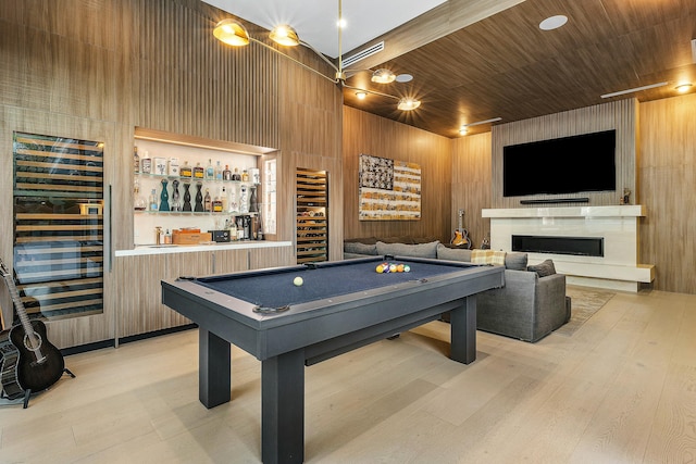 recreation room with wood walls, light hardwood / wood-style flooring, wood ceiling, and pool table