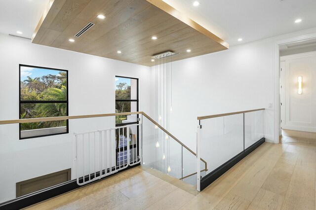 bedroom with access to exterior, light hardwood / wood-style flooring, ceiling fan, and floor to ceiling windows