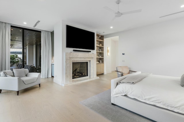 bedroom featuring light hardwood / wood-style flooring and ceiling fan