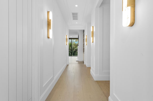 hallway with light hardwood / wood-style flooring