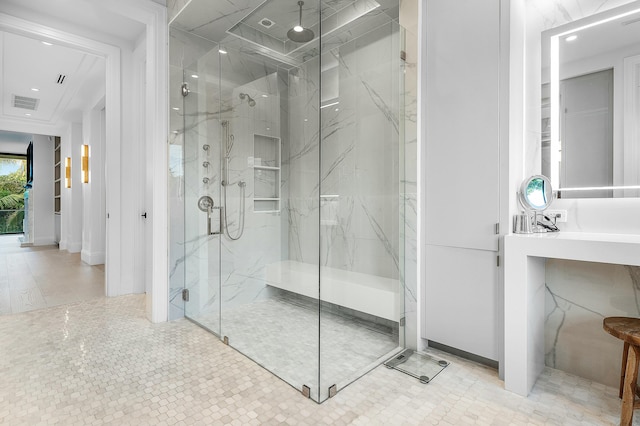 bathroom with a shower with door