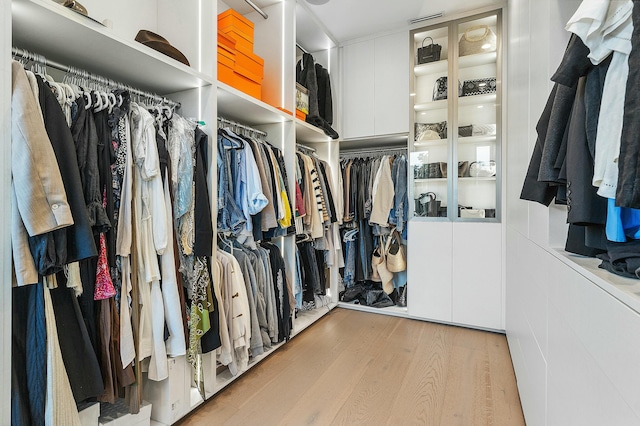 walk in closet featuring light hardwood / wood-style flooring