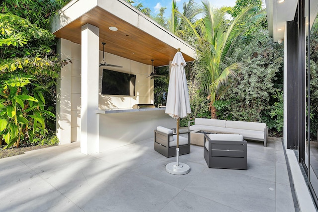 view of patio / terrace featuring an outdoor living space, an outdoor bar, and ceiling fan