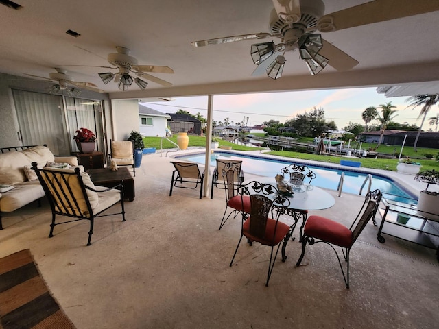 patio terrace at dusk with ceiling fan