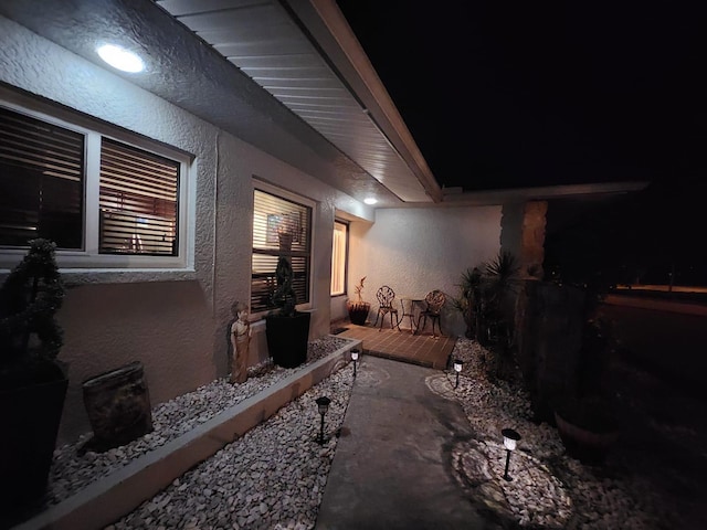 view of property exterior at night