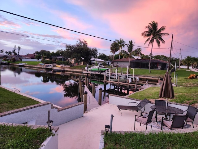 dock area with a water view