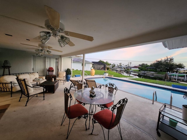 view of pool with outdoor lounge area and a patio area