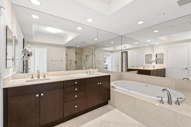 bathroom featuring vanity, separate shower and tub, a raised ceiling, crown molding, and tile patterned flooring