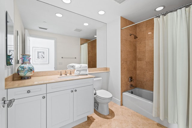 full bathroom featuring tile patterned floors, vanity, toilet, and shower / tub combo with curtain