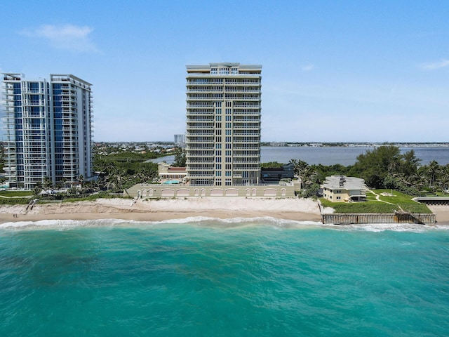 birds eye view of property featuring a water view and a view of the beach