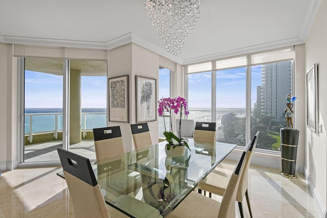 tiled dining space featuring a water view, crown molding, and a notable chandelier